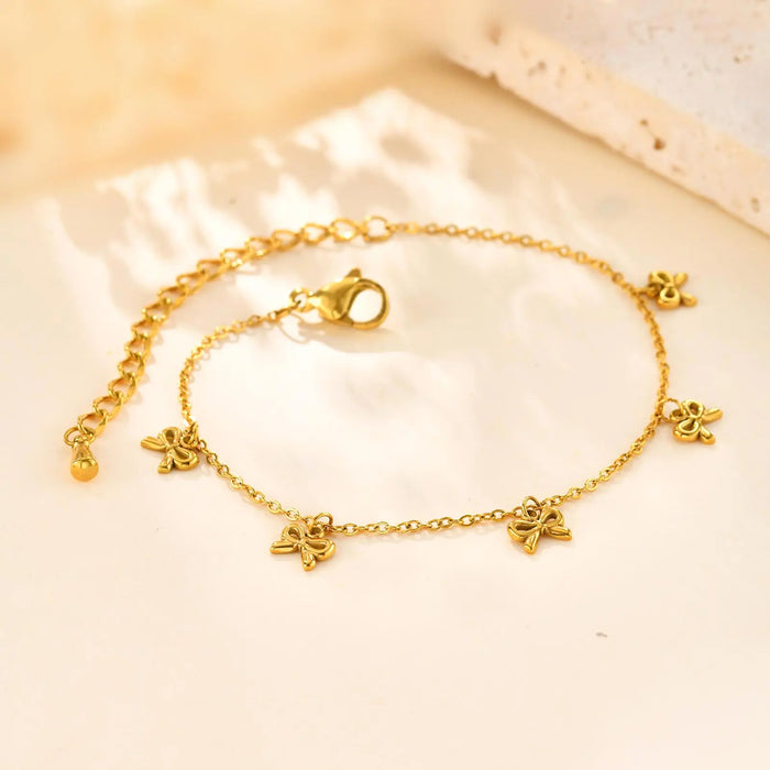 Goldfarbenes Armband mit Schleifen